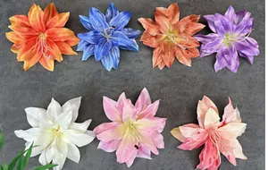 Top view of handmade artificial lily flower heads in various colors for DIY decor