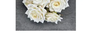 Close-up of seven-headed white artificial diamond roses with realistic silk texture