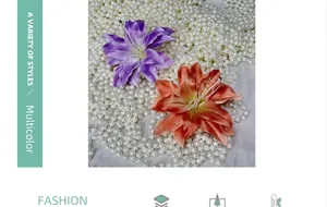 Macro detail of silk lily hair clips in purple and orange with pearl accents