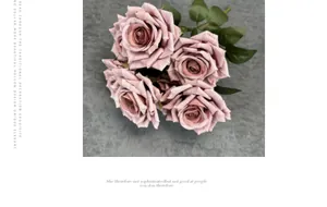 Close-up of Morandi pink silk roses with realistic petal texture and green leaves