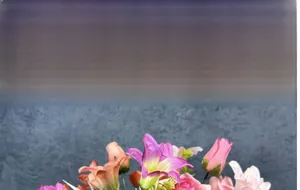 Detailed view of artificial rose and lily bouquet in purple and pink tones