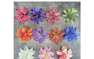 Flat lay view of artificial lily flower heads in eleven assorted colors for DIY crafts