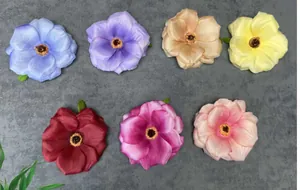 Detailed top view of seven multicolored silk artificial rose heads for DIY crafts