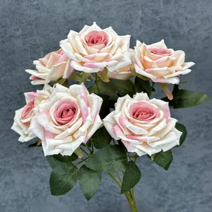 A bouquet of 7 premium pink and white gradient artificial silk roses for home decor