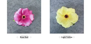 Detalle de cabezas de flores de seda artificiales en rojo rosa y amarillo pálido para DIY
