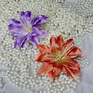 Vintage style handmade lily flower hair clips and decor on pearl beads background