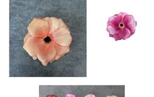 Primer plano de cabezas de flores de seda realistas con pétalos vibrantes de color naranja y magenta