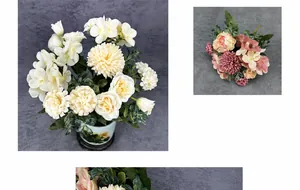 Detailed view of white pompom mums and pink roses in a landscape ceramic flowerpot