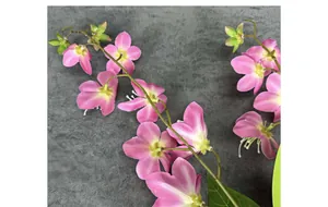Detailed close-up of 3D printed pink jasmine flowers with gradient petals and green buds