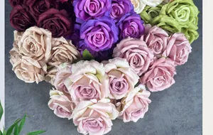 Detailed macro view of artificial silk rose flower heads in multiple colors