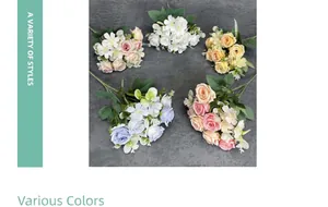 Flat lay of artificial rose and daisy bouquets in various colors for home decor