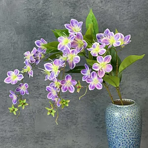 Artificial drooping jasmine spray with 3D printed purple gradient petals in a blue vase