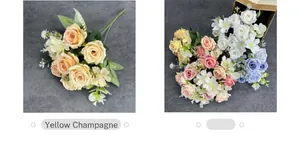 Detailed texture of silk champagne rose petals and artificial green leaves on gray fabric