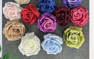 Flat lay detail of colorful 11cm artificial silk rose heads for wedding DIY decoration