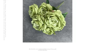Detailed view of 7-head artificial green roses with silk petals and green leaves