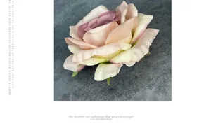 Macro view of a 11cm lifelike faux rose head with gradient pink petals for decor