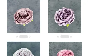 Primo piano di teste di peonie e rose artificiali in seta in tonalità viola e rosa