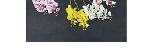 Detailed overhead view of lifelike artificial orchid stems in pink, yellow and white colors