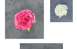 Detailed view of silk peony and rose heads in pink and cream for wedding decor