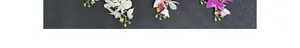 Detailed close-up of realistic faux Phalaenopsis orchid branches in multiple colors