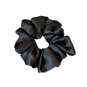 Glossy black satin hair scrunchie for women with high quality silk fabric texture