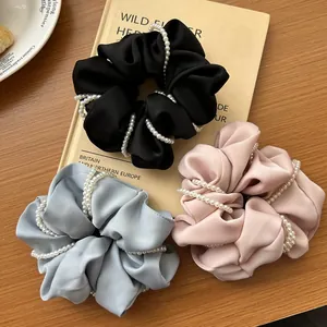 Elegant satin scrunchie set with pearl wrap decoration in black, blue, and pink colors