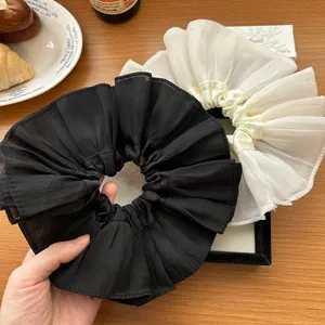 French oversized pleated scrunchies in black and beige chiffon for elegant hairstyles