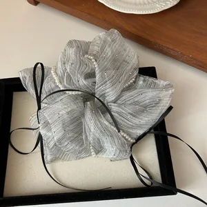 Gray organza scrunchie with sparkling rhinestones, white pearls and black ribbon bow