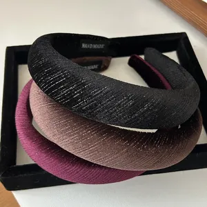 Close-up of velvet glitter sponge headbands in black, coffee and purple colors