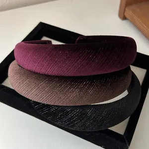 Three textured velvet padded headbands in burgundy, dark brown and black colors
