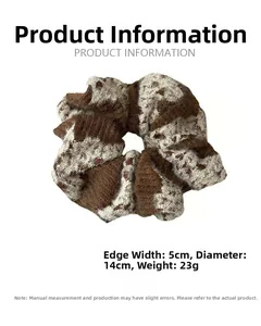 Detail view of large knit scrunchie with 14cm diameter and animal print pattern