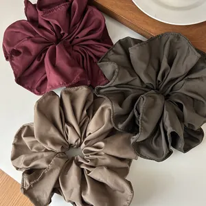 Three-piece set of large satin scrunchies in burgundy, dark green, and khaki retro colors