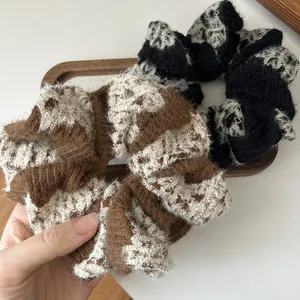 Knitted checkers scrunchies in black and brown with soft plush texture for women