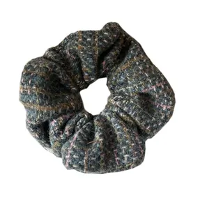Classic tweed checkered scrunchie in grey and pink yarn knit for elegant hair styling