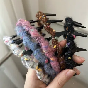 Set of wavy knit hair clips with soft colorful wool texture for a cozy autumn look