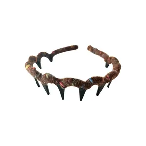Colorful wavy knitted headband with soft fuzzy texture and integrated hair comb teeth