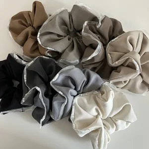 Elegant mesh lace hair scrunchies with pearls in various neutral colors shown in top view