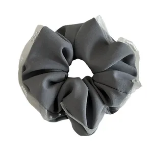 Elegant dark grey mesh hair scrunchie with lace edge and faux pearls for low ponytail styling