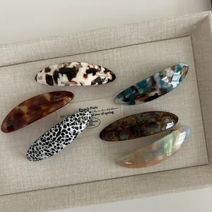 Set of 6 oval acetate hair clips in assorted tortoiseshell and marble patterns
