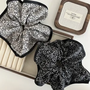 French vintage floral scrunchies with satin edges in classic black and white patterns