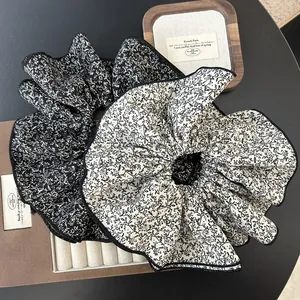 Floral chiffon oversized scrunchies in black and white set with layered ruffles