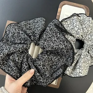 Floral chiffon oversized scrunchies in black and white patterns with elegant piping