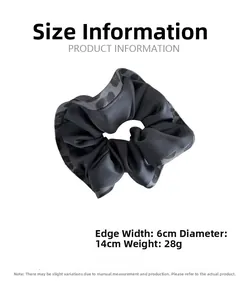 Detail view of leopard print scrunchie showing 14cm diameter and 6cm width size specs