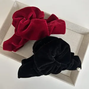 French vintage velvet hair claw clips in burgundy and black with gold metal tag detail