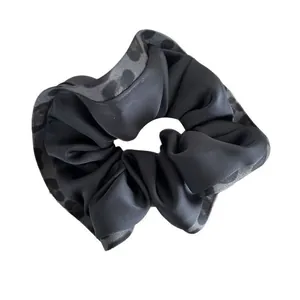 Large black matte scrunchie with leopard print lace edges for hair styling