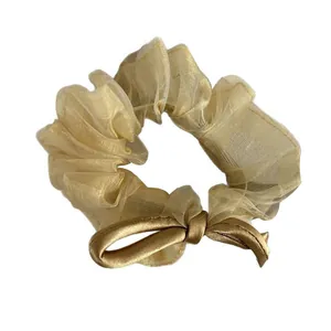 Elegant champagne gold sheer tulle scrunchie with a satin bow knot for women