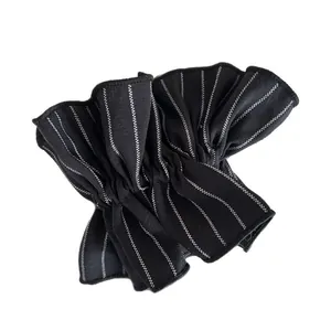 Classic black and white striped scrunchie with pleated ruffle edges for hair styling