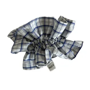 Blue and white plaid scrunchie with ruffled texture and premium fabric finish
