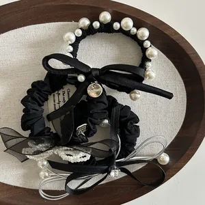 Set di elastici per capelli neri con perle bianche e fiocchi in raso fatti a mano