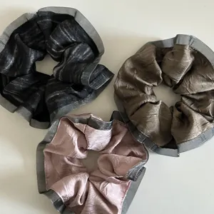 Three-piece metallic crinkle fabric scrunchies in black, brown and dusty pink set